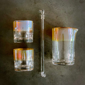 The Aristocrat Cocktail Set - alined in a grid. Two rocks glasses, one cocktail spoon, and one mixing glass.