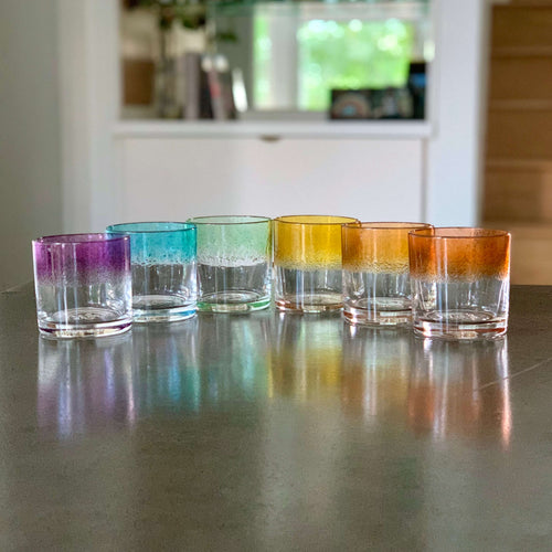 Set of 6 Rocks Glasses in a striped ROYGBV rainbow color pattern.