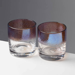 The Royal cocktail glasses with purple color stripe against a contrasting gray background.